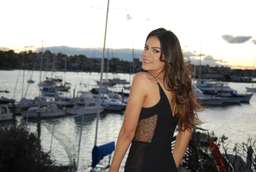 Black knee length Nicholas dress with mesh side cut outs