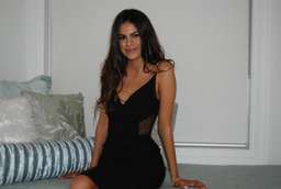 Black knee length Nicholas dress with mesh side cut outs