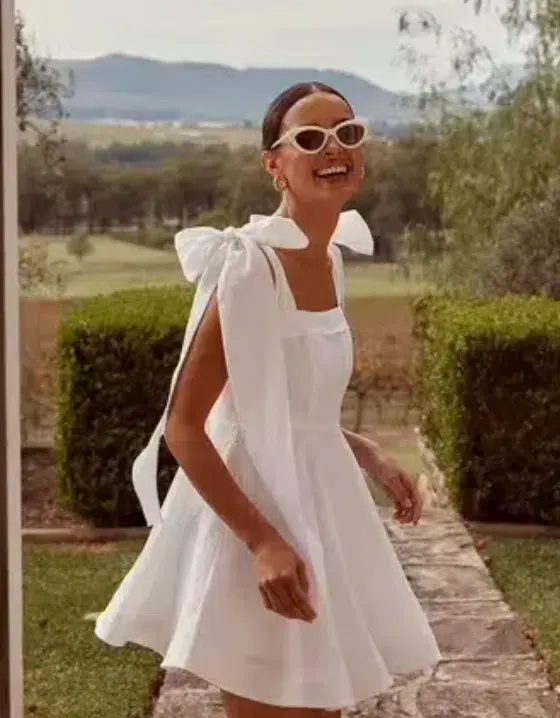 Dissh Aisle Linen Bow Mini Dress White Size 6 for rent on The Volte - main image