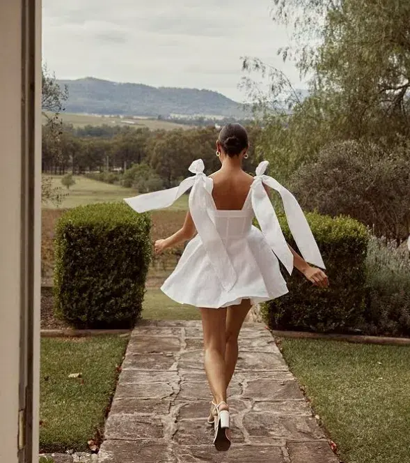 Dissh Aisle Bow Mini Dress White Size 8 for rent on The Volte - main image