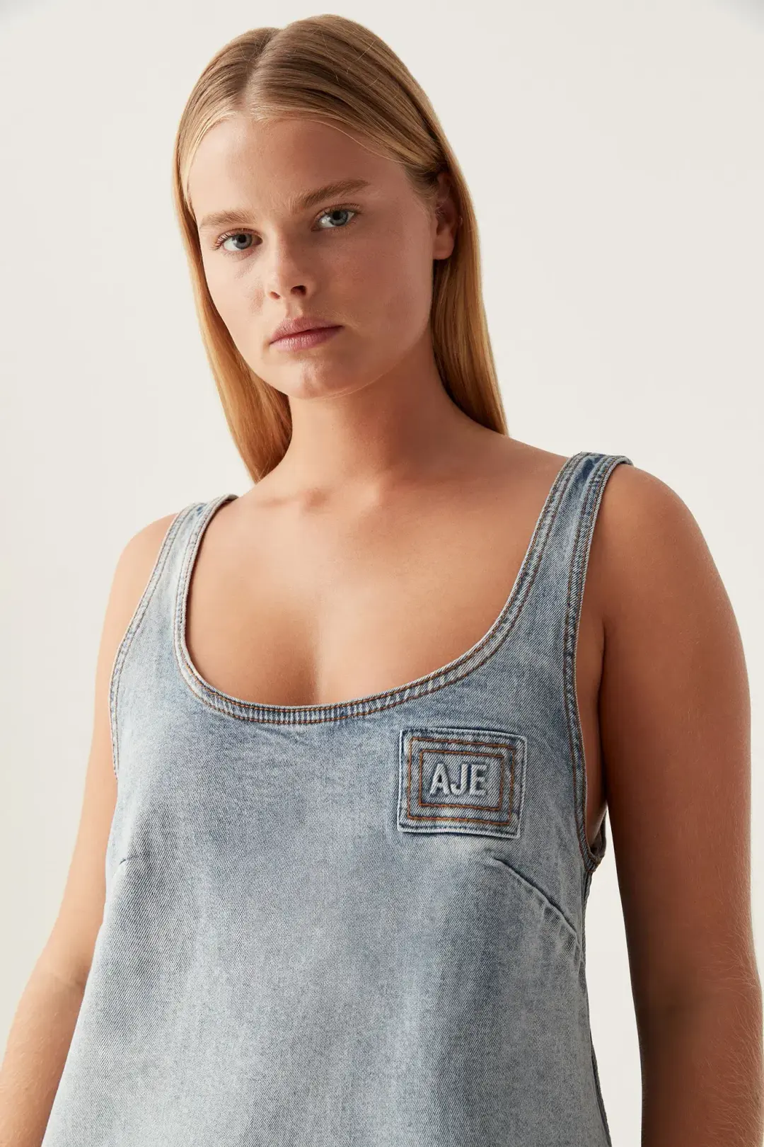 Aje Bambie Denim Mini Dress Two Tone Indigo Size AU 4 for rent on The Volte - main image