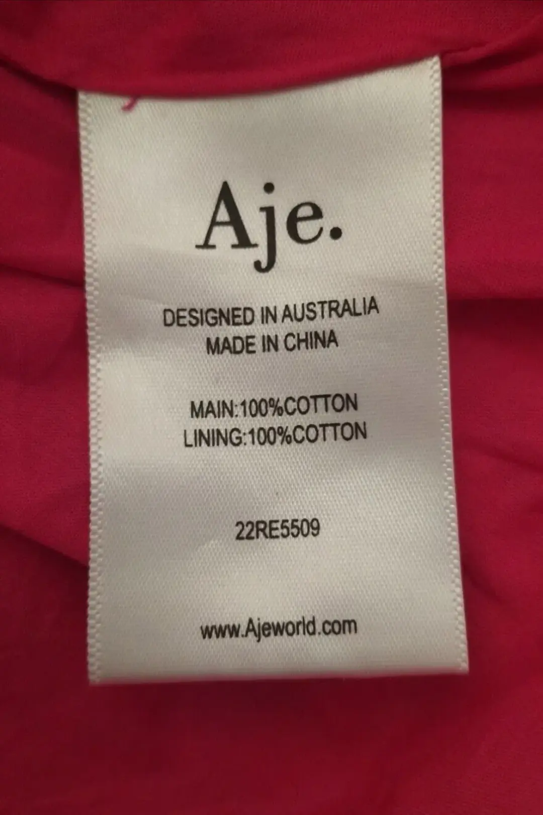 AJE Maya Tiered Mini Dress Fuchsia with side pockets AU 6 US 2 for rent on The Volte - main image