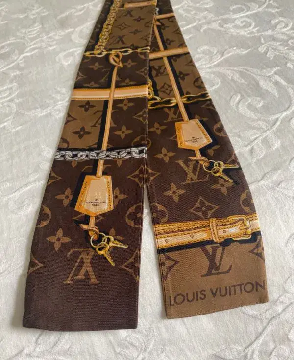 Louis Vuitton Silk Monogram Confidential Bandeau Scarf Brown for rent on The Volte - main image
