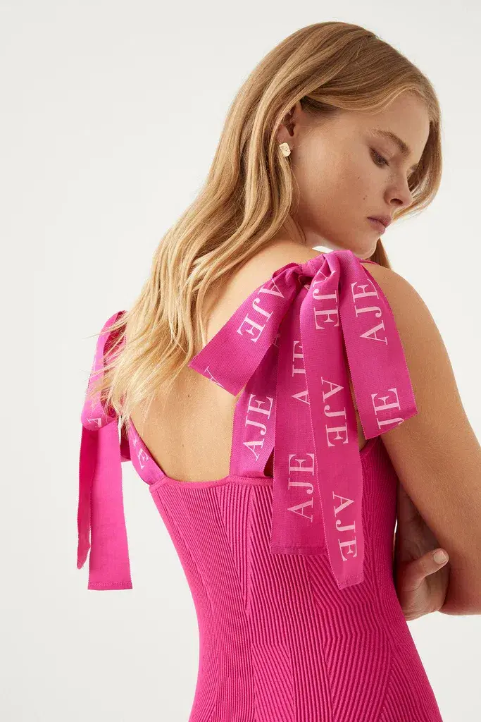 Aje Amber Knit Tie Shoulder Mini Dress in Fuchsia Size 8 / S for rent on The Volte - main image