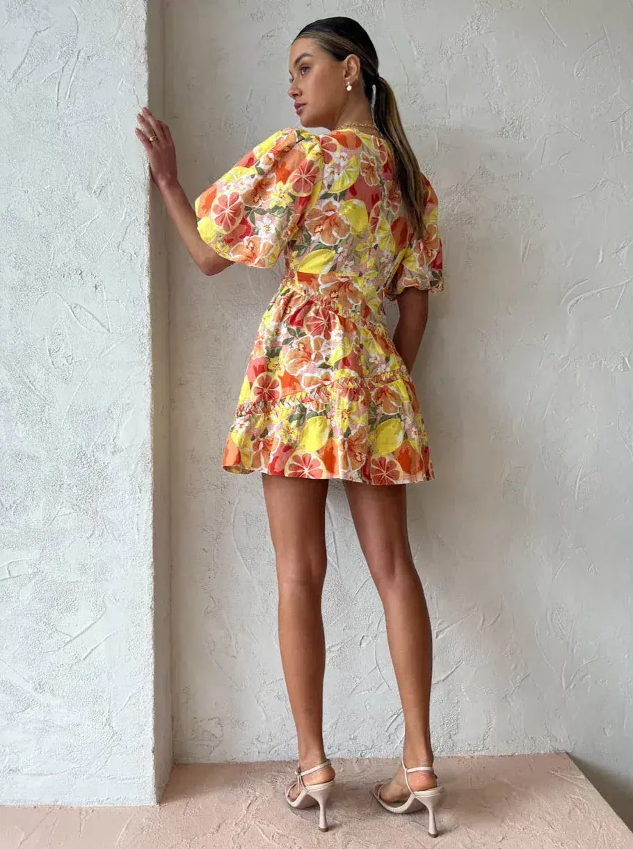By Nicola Sol Puff Sleeve Mini Dress In Citrus Print Orange Size AU 8 for rent on The Volte - main image