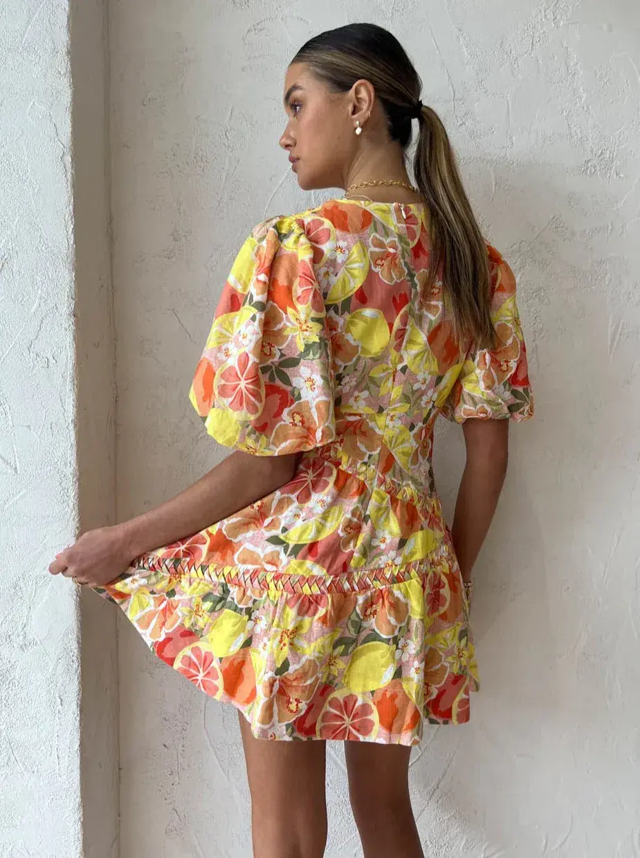 By Nicola Sol Puff Sleeve Mini Dress In Citrus Print Orange Size AU 8 for rent on The Volte - main image