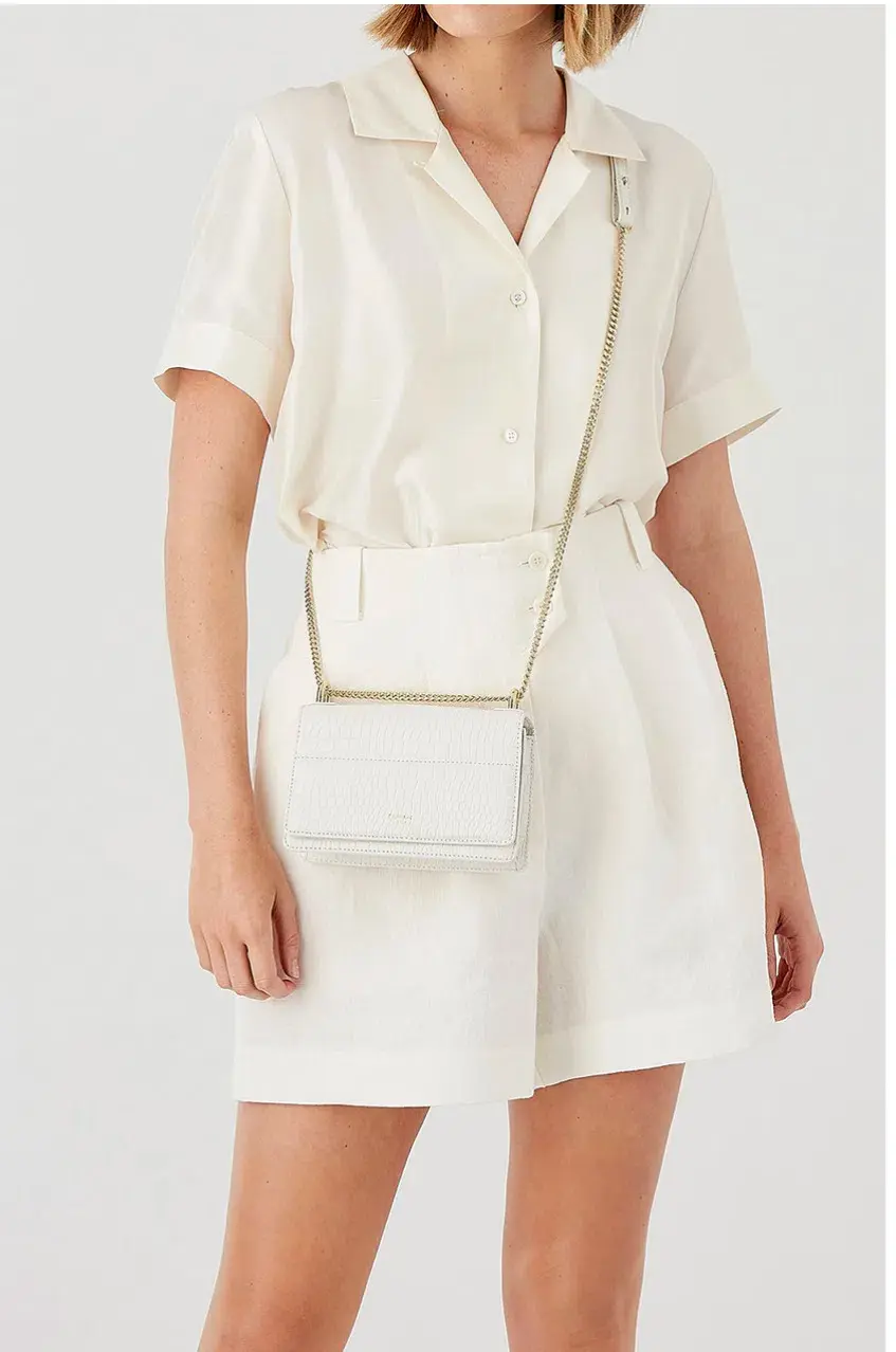 Oroton Forte Micro Clutch in Cream for rent on The Volte - main image