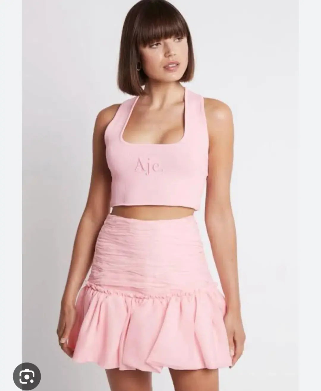 Aje Myriad Pink Tiered Mini Skirt for rent on The Volte - main image
