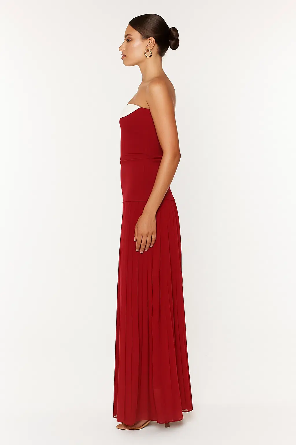 She is OLLÁ Nicolette Maxi Dress in Raspberry Size 8 for rent on The Volte - main image