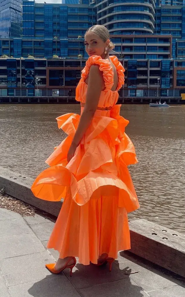 Aje Medina Ruched Crop Top and Tiered Midi Skirt Set Orange Size 10 for rent on The Volte - main image