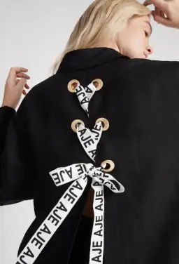 Aje Virtuous Lace-Up Longline Shirt In Black Size 10 for rent on The Volte - image 2